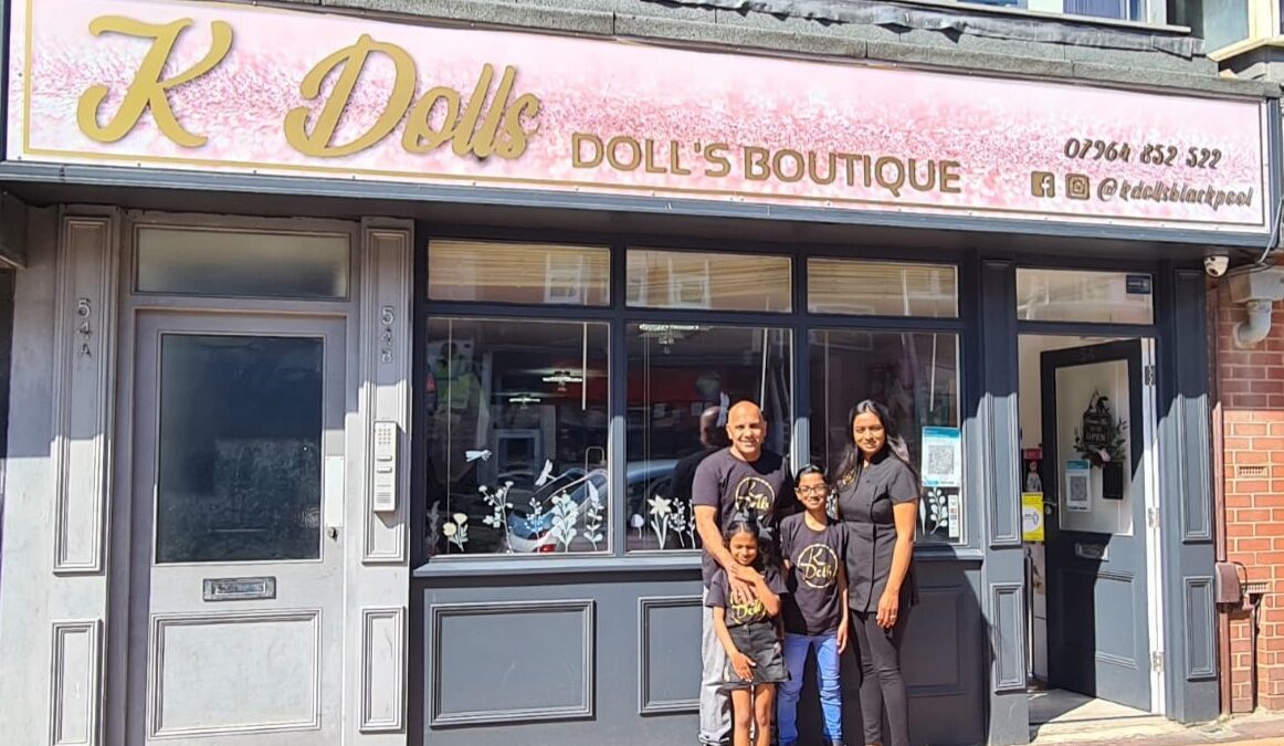 Family stood outside their new shop