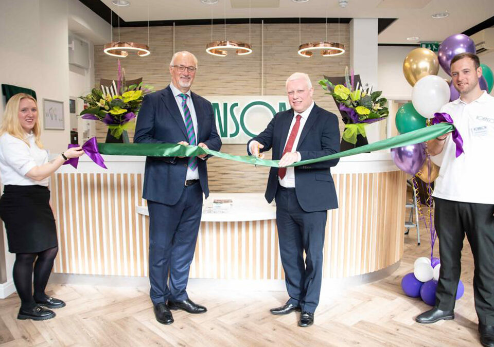 cutting the ribbon at the launch of the Robinson