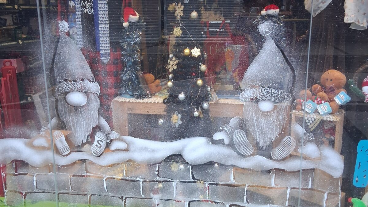 Shop window with a snow sprayed festive scene
