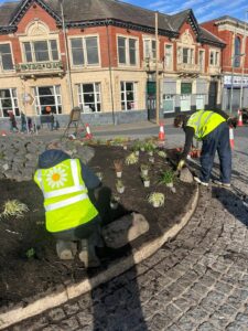 Landscapers planting on the roundabout